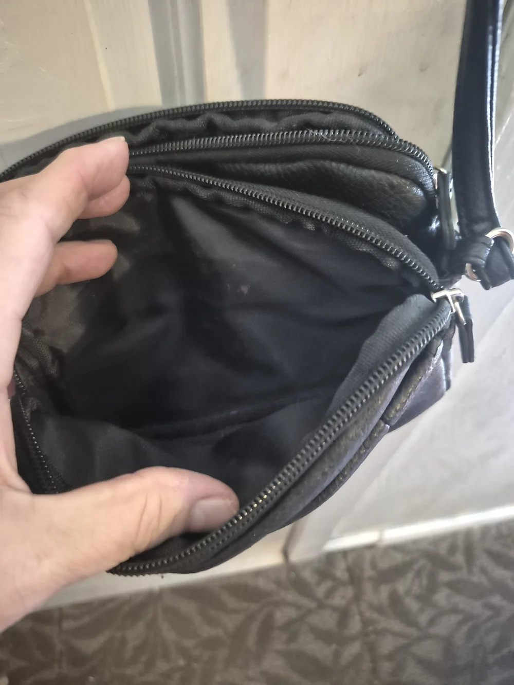 MultiSac Black Leather Crossbody Bag - Polished Logo Accent
